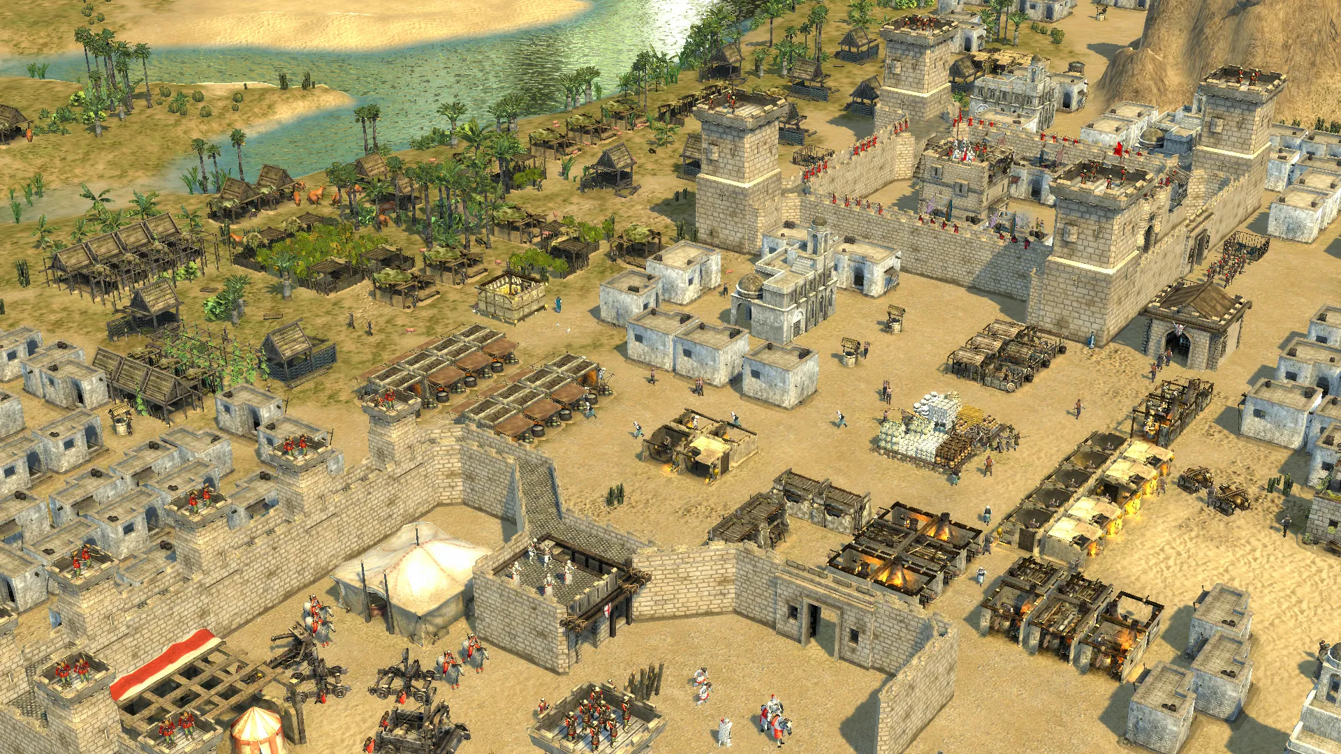 Tampilan kota yang sedang dibangun di Stronghold Crusader 2 dari sudut pandang atas